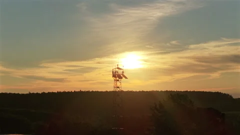 Fire Watchtower Silhouette Against Dramatic Sunset Sky Stock Footage 340149755