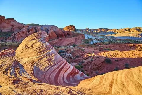 Fire Wave Swirling Sandstone Patterns at Golden Hour Moapa Valley Perspective Fotos de archivo