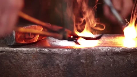 Fire welding between hammer and anvil Stock Footage 133954241
