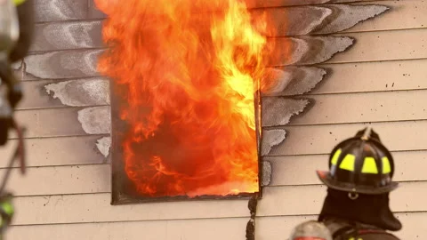 Fire in Window and Firemen Assessing Fire 動画素材 197446614