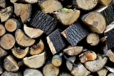 Fire wood pattern background closeup - stacked logs Stock Photos