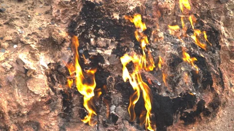 Fire in Yanar Dagh, Azerbaijan - perpetually burning mountain, natural gas flame Stock Footage 322090775