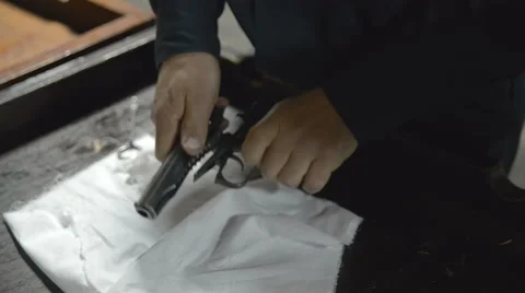 Firearm dis-assembly for cleaning and safety check of handheld gun Видео 62447549