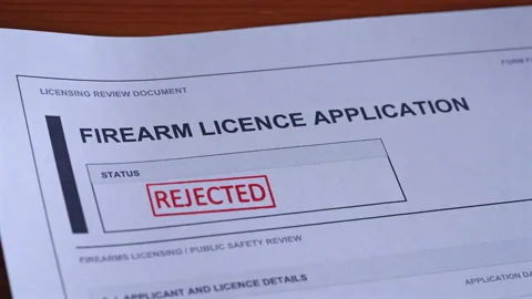 Firearm Licence Application Rejected Stamp Coming Down On Form Stock Footage 345635857