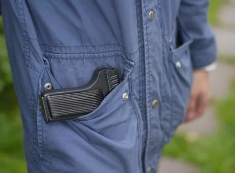 Firearm in pocket 库存照片