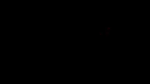 Fireball and exploding embers on black Stock Footage 255853686