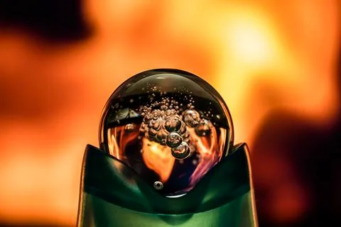 Fireball. The ball is a sphere with the fire of the flame reflected in it. th Stock Photos