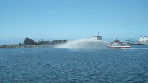 Fireboat doing water gun test on Port of Long Beach Stock Footage 116477513