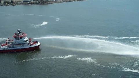 Fireboat doing water gun test near the coast on Port of Long Beach Stock Footage 116478294