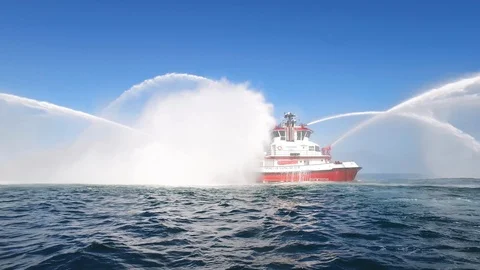 Fireboat Protector doing foam spray tests in the sea Stock Footage 116496821