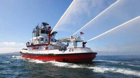Fireboat Protector doing foam spray tests on Port of Long Beach Stock Footage 116497391