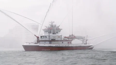 Fireboat Protector doing water gun tests in open water Stock Footage 116474418
