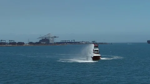 Fireboat Protector doing water gun tests in open water Stock Footage 116490042