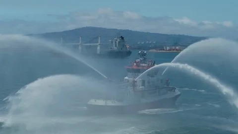 Fireboat Protector doing water gun tests in open water Video stock 116490065