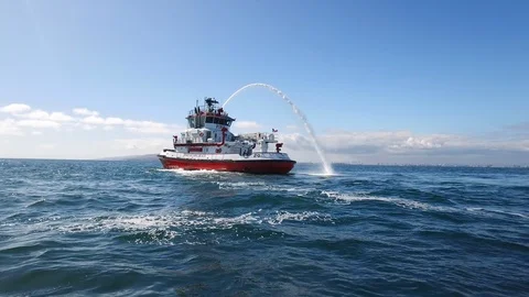 Fireboat Protector doing water gun test in the sea Video stock 116497224
