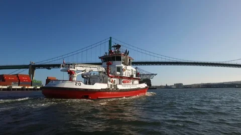 Fireboat Protector sailing under the bridge on Port of Long Beach Stock Footage 116495768