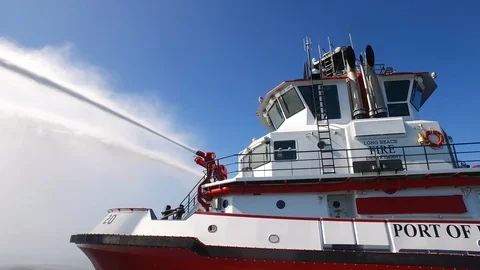 Fireboat Protector testing foam spray at the sea Stock Footage 116498094