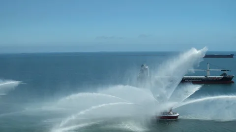 Fireboats Protector and Vigilance doing coordinated water gun test operations Stock Footage 116475529