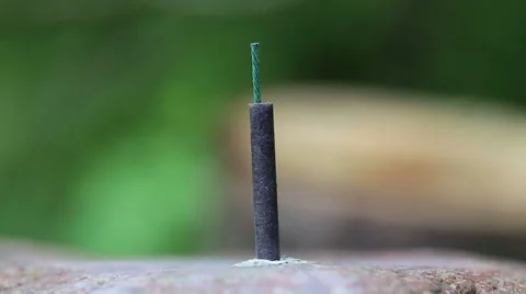 Firecracker explodes from the burning wick. Stock Footage 50019162