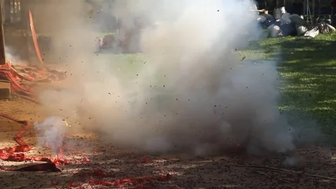 Firecracker exploding on ground 스톡 동영상 77660810