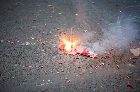 Firecracker exploding in the street Foto stock