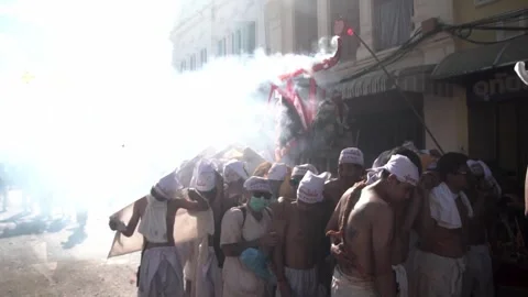 Firecracker explosions during the Phuket vegetarian festival. Stock Footage 261954764