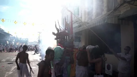 Firecracker explosions during the Phuket vegetarian festival. Stock Footage 261955228