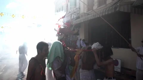 Firecracker explosions during the Phuket vegetarian festival. Stock Footage 261955483