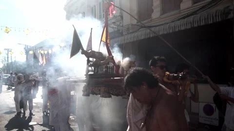 Firecracker explosions during the Phuket vegetarian festival. Stock Footage 261955842