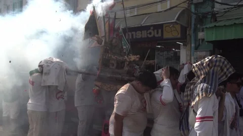 Firecracker explosions during the Phuket vegetarian festival. Stock Footage 261957560