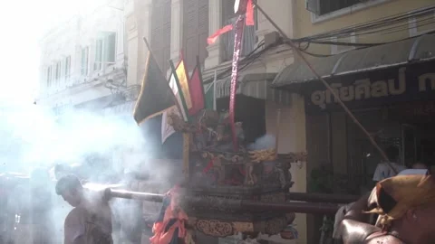 Firecracker explosions during the Phuket vegetarian festival. Stock Footage 261957951