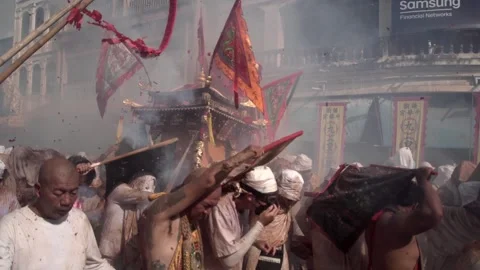 Firecracker explosions during the Phuket vegetarian festival. Stock Footage 261991519