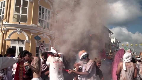Firecracker explosions during the Phuket vegetarian festival. Stock Footage 262016717