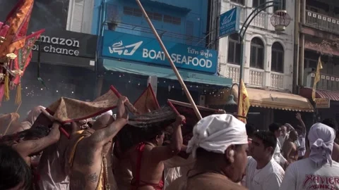 Firecracker explosions during the Phuket vegetarian festival. Stock Footage 262017186