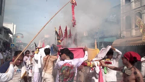 Firecracker explosions during the Phuket vegetarian festival. Stock Footage 262026864