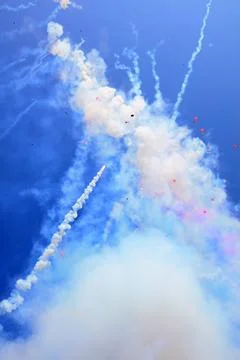 Firecracker smoke in the blue sky Stock Photos