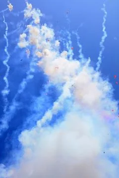 Firecracker smoke in the blue sky Stock Photos