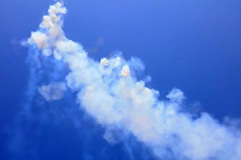 Firecracker smoke in the blue sky Stock Photos