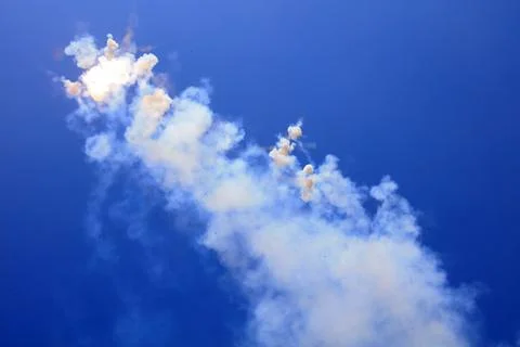 Firecracker smoke in the blue sky Stock Photos