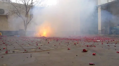 Firecrackers crackling and spluttering on the Chinese new year Stock Footage 34839984