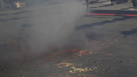 Firecrackers explode during the celebration of Chinese New Year. 4k Stock Footage 117753318