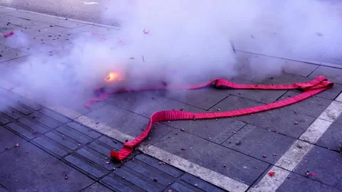 Firecrackers exploded, with firecrackers paper and dust on the ground 스톡 동영상 152495315