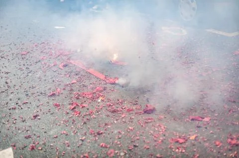 Firecrackers exploding in the street for the chinese new year Stock Photos
