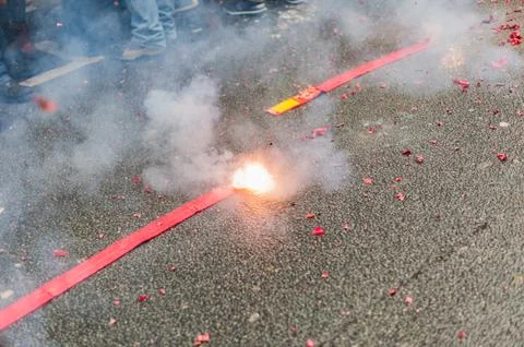 Firecrackers exploding in the street Stock Photos