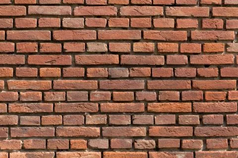 Fired brick wall - background texture. Stock Photos