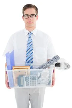 Fired businessman holding box of belongings Stock Photos