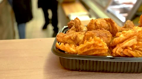 Fired chicken and fires on a restaurant counter Stock Footage 131919020