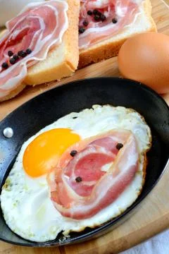 Fired egg with bacon Stock Photos