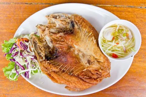 Fired fish with mango sauce delicious thai food Stock Photos