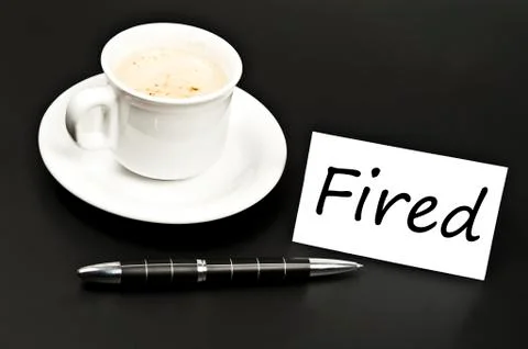 Fired message on desk with coffee Stock-Fotos